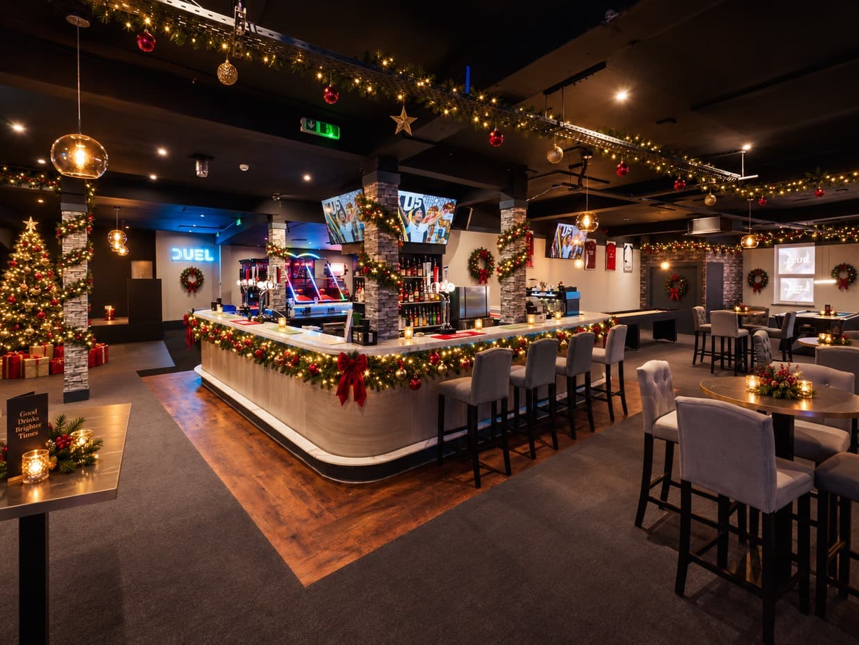 DUEL's upstairs bar dressed for Christmas, with garlands, wreaths and a tree